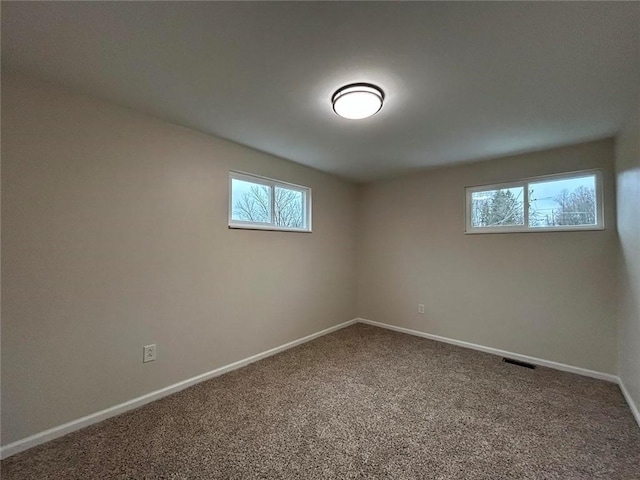 spare room featuring carpet floors