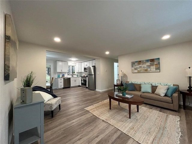 living room with dark hardwood / wood-style flooring