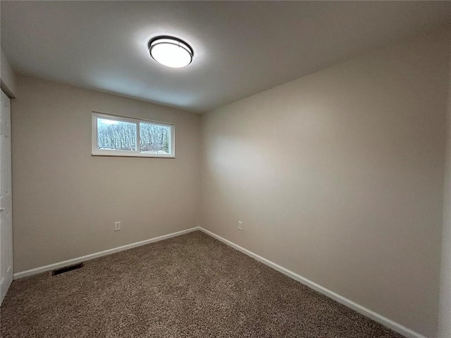 unfurnished room with carpet flooring