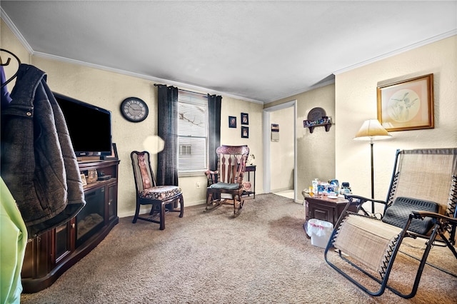 sitting room with carpet floors and ornamental molding