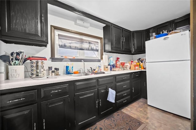 kitchen featuring sink and white refrigerator