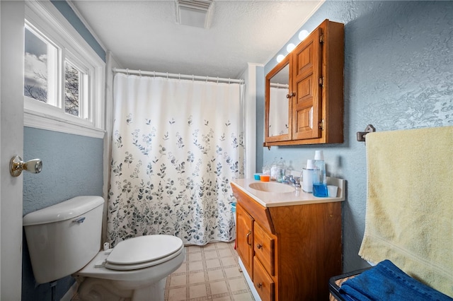 bathroom with vanity, toilet, and a shower with shower curtain