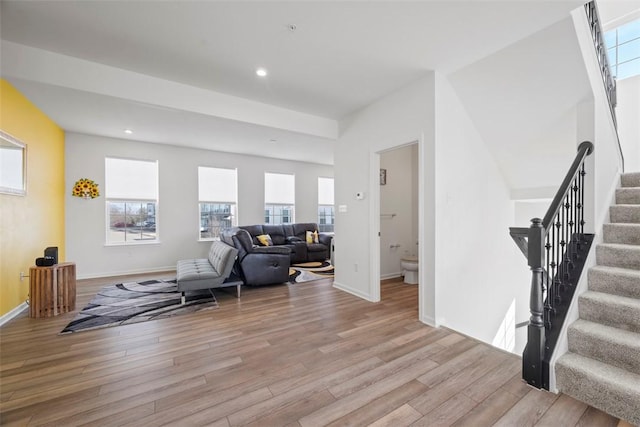 living room with plenty of natural light and light hardwood / wood-style floors