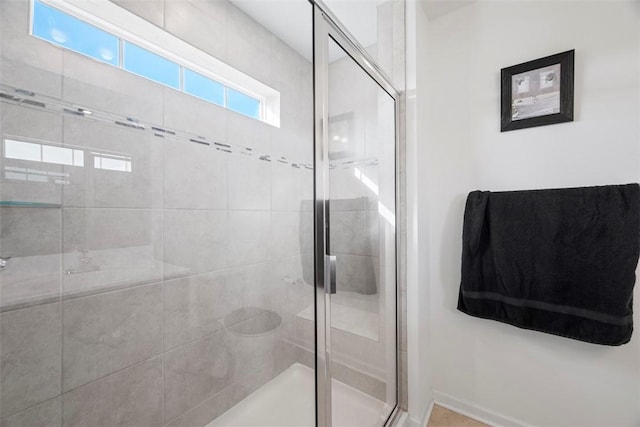 bathroom featuring an enclosed shower