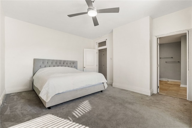 bedroom featuring ceiling fan and carpet