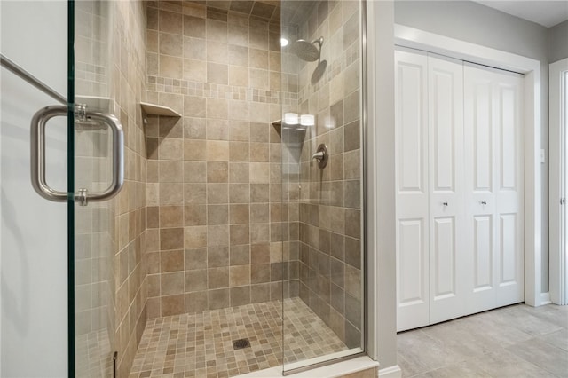 bathroom featuring a shower with door