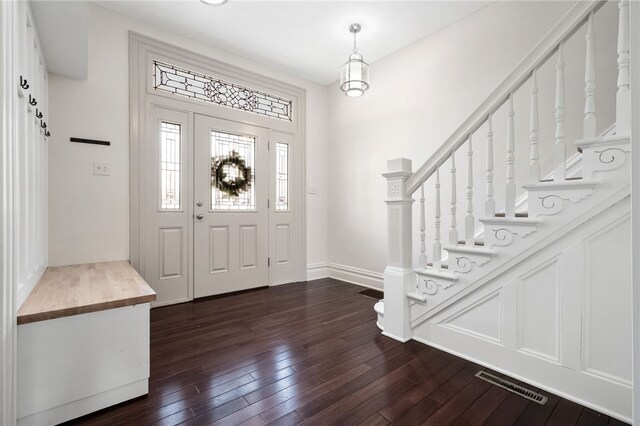 entrance foyer with dark hardwood / wood-style flooring