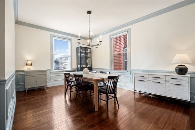 dining room featuring an inviting chandelier, crown molding, and dark wood-type flooring