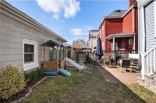 view of yard with a patio area and a playground