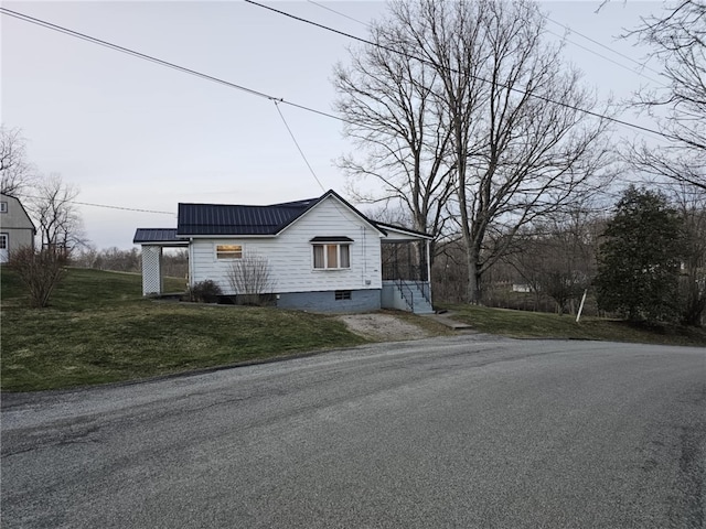 view of side of home featuring a yard