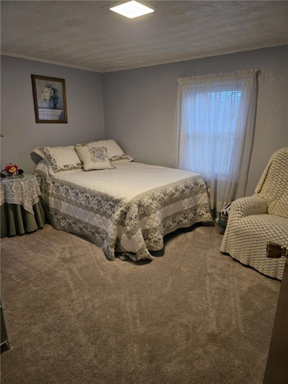 carpeted bedroom with crown molding