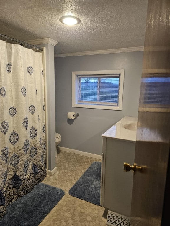 bathroom with vanity, toilet, crown molding, a textured ceiling, and a shower with curtain