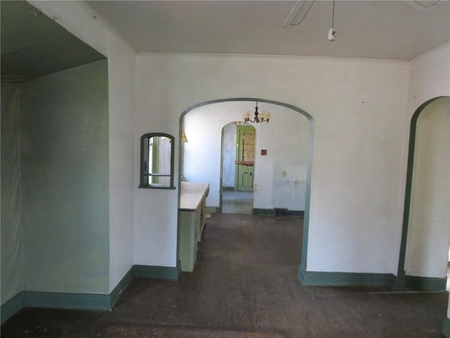 hallway featuring crown molding and dark hardwood / wood-style floors