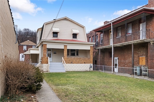 view of front of home featuring a porch and a front lawn