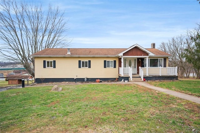 view of front facade featuring a front lawn and covered porch