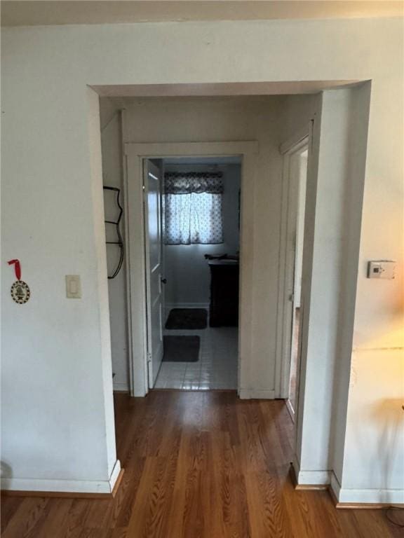 hallway featuring dark wood-type flooring