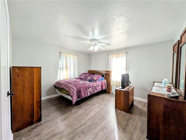 bedroom featuring hardwood / wood-style flooring and ceiling fan