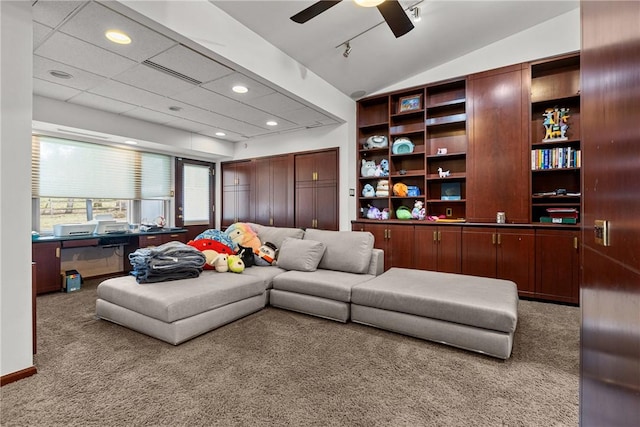 living room featuring vaulted ceiling, light colored carpet, and ceiling fan