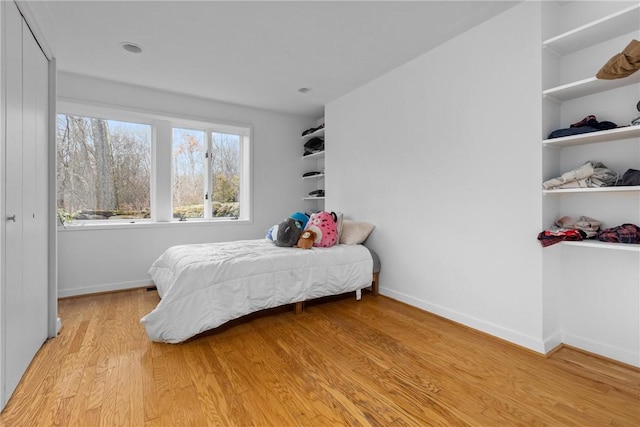 bedroom with light hardwood / wood-style floors