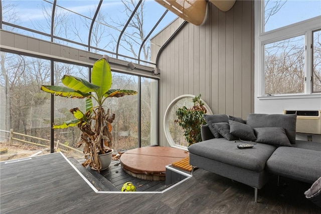 sunroom / solarium with an AC wall unit