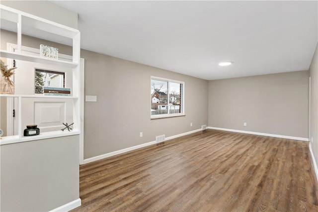 empty room featuring hardwood / wood-style flooring