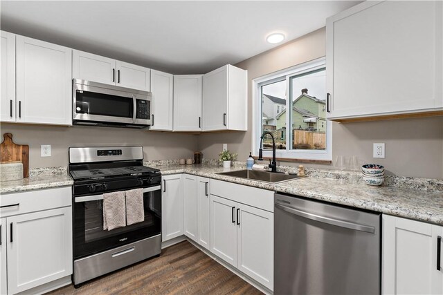 kitchen featuring white cabinetry, appliances with stainless steel finishes, and sink