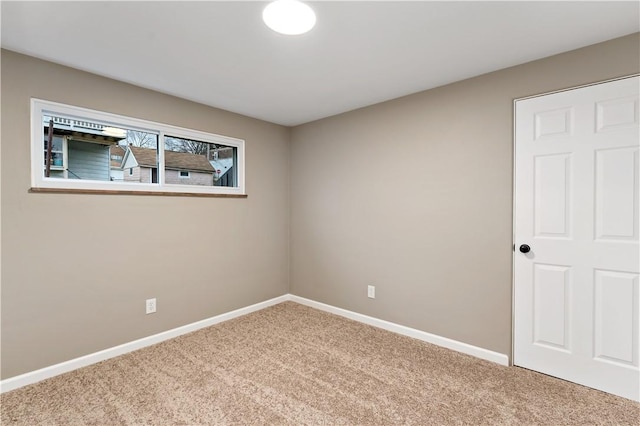 unfurnished room featuring carpet floors
