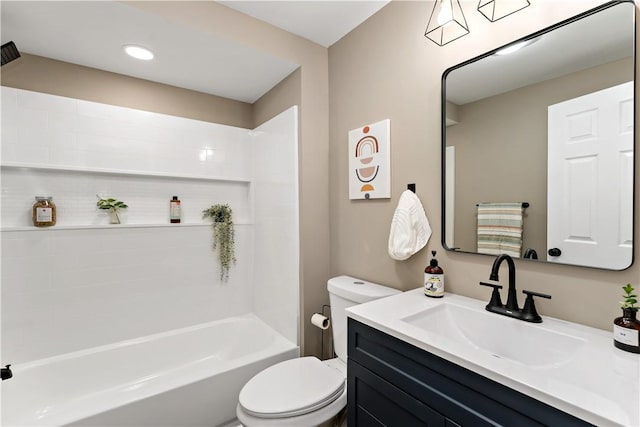 full bathroom featuring vanity, bathtub / shower combination, and toilet