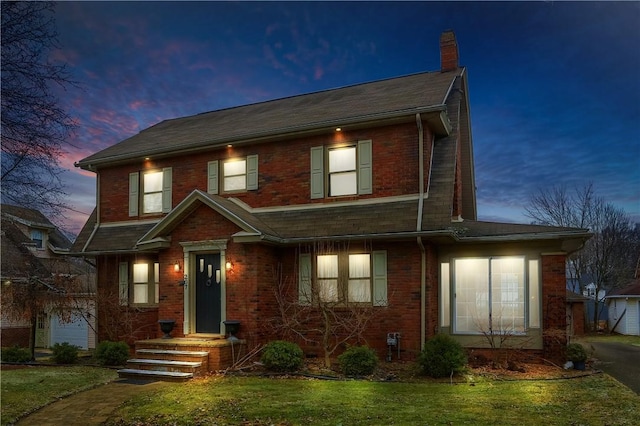 view of front of property with a lawn