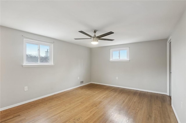 empty room with ceiling fan and light wood-type flooring