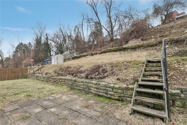 view of yard with a storage shed