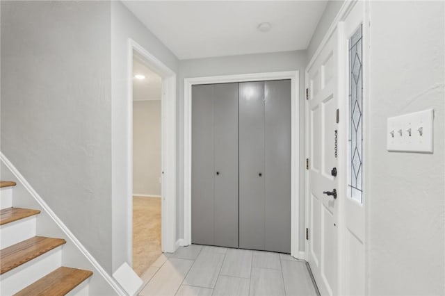 hallway featuring light tile patterned floors