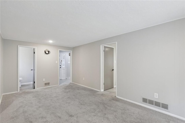 empty room featuring light colored carpet