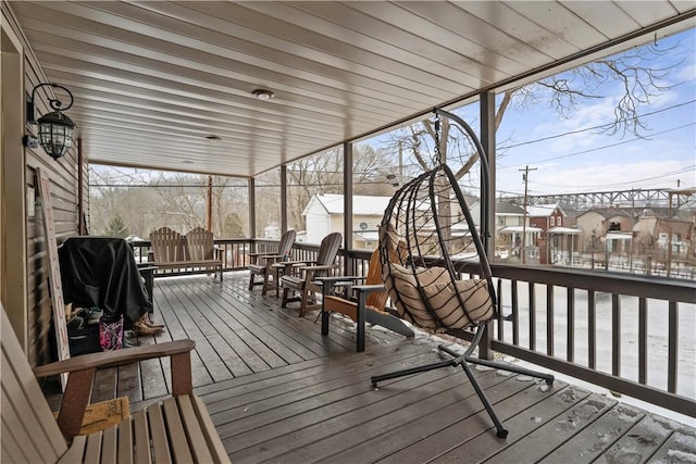 snow covered deck featuring grilling area