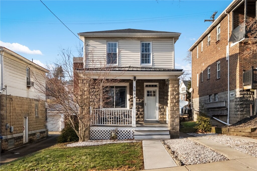 front facade with a porch
