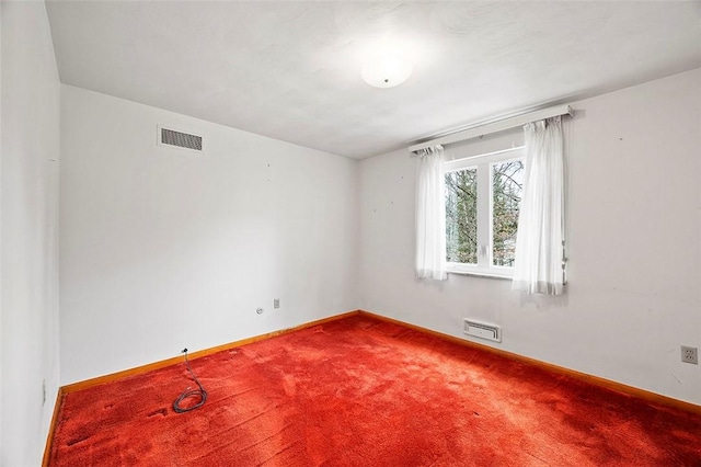 empty room featuring carpet flooring