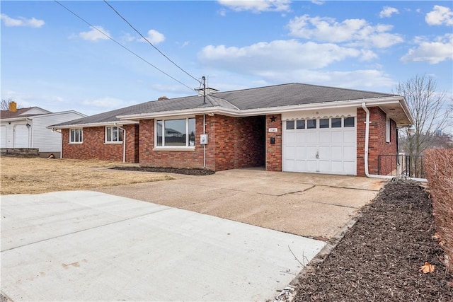 ranch-style home featuring brick siding, driveway, and an attached garage