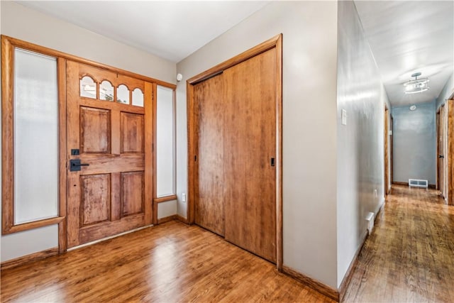 foyer entrance featuring hardwood / wood-style floors