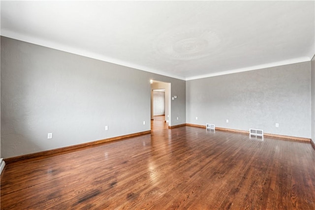 empty room with wood-type flooring