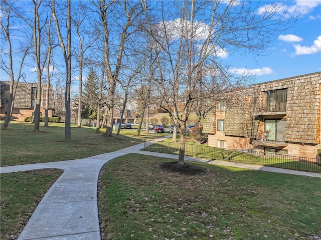 view of home's community with a yard