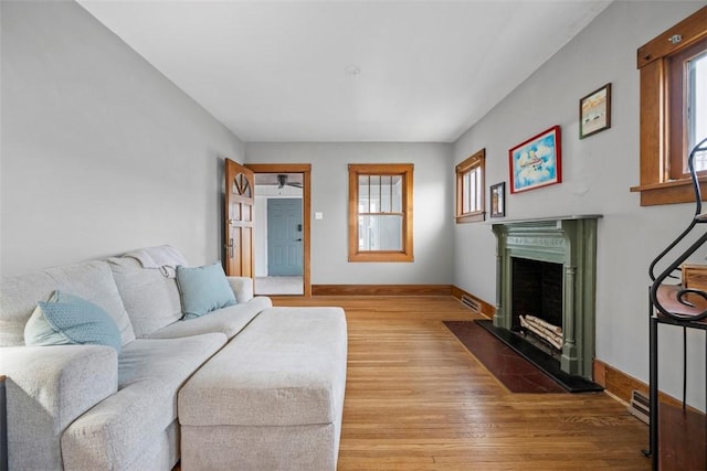 living room with a wealth of natural light and light wood-type flooring