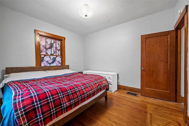 bedroom featuring hardwood / wood-style flooring