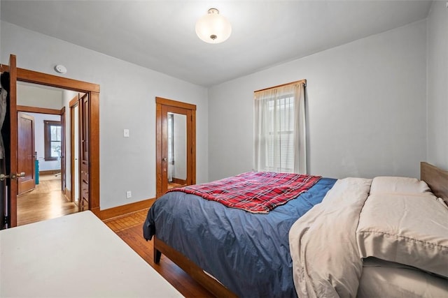 bedroom with hardwood / wood-style flooring