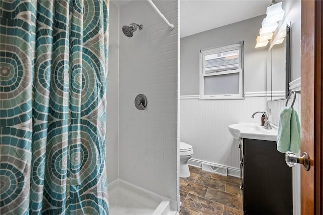 bathroom featuring vanity, toilet, and walk in shower