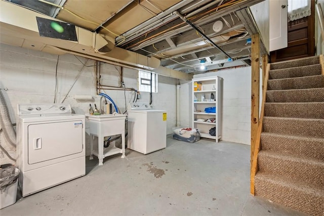 basement with washing machine and clothes dryer