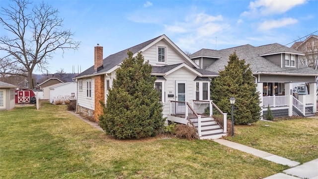 bungalow-style house with a front yard