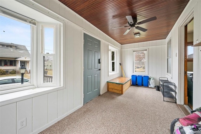 mudroom featuring ceiling fan, light carpet, and wood ceiling