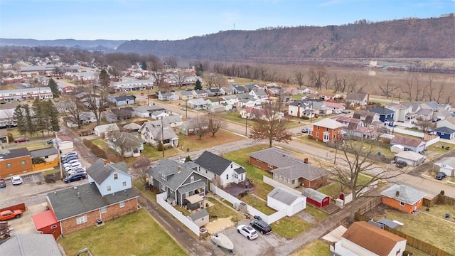 birds eye view of property with a mountain view