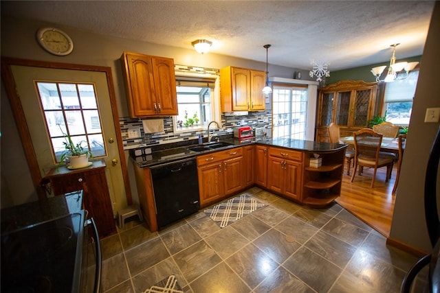 kitchen with sink, tasteful backsplash, decorative light fixtures, dishwasher, and kitchen peninsula