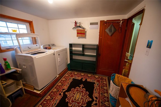 laundry area with separate washer and dryer